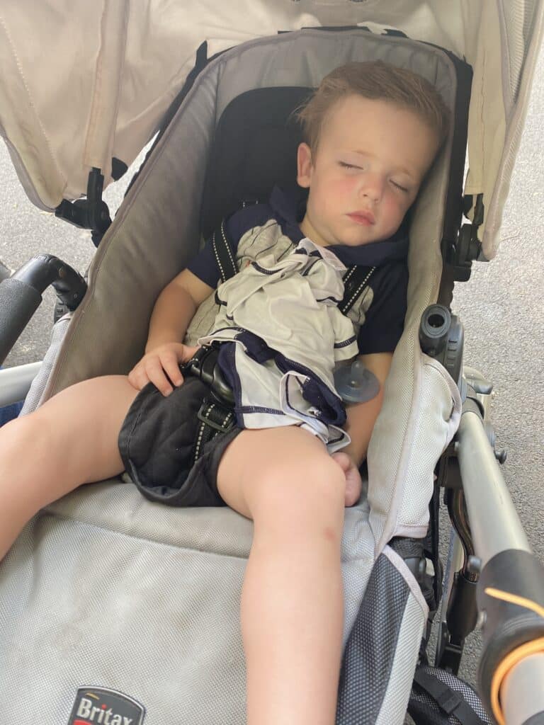 Toddler sleeping in a stroller